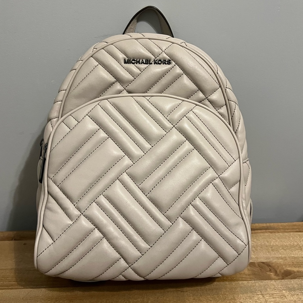 Brand new Michael Kors backpack purse.  Never used.  In excellent condition.